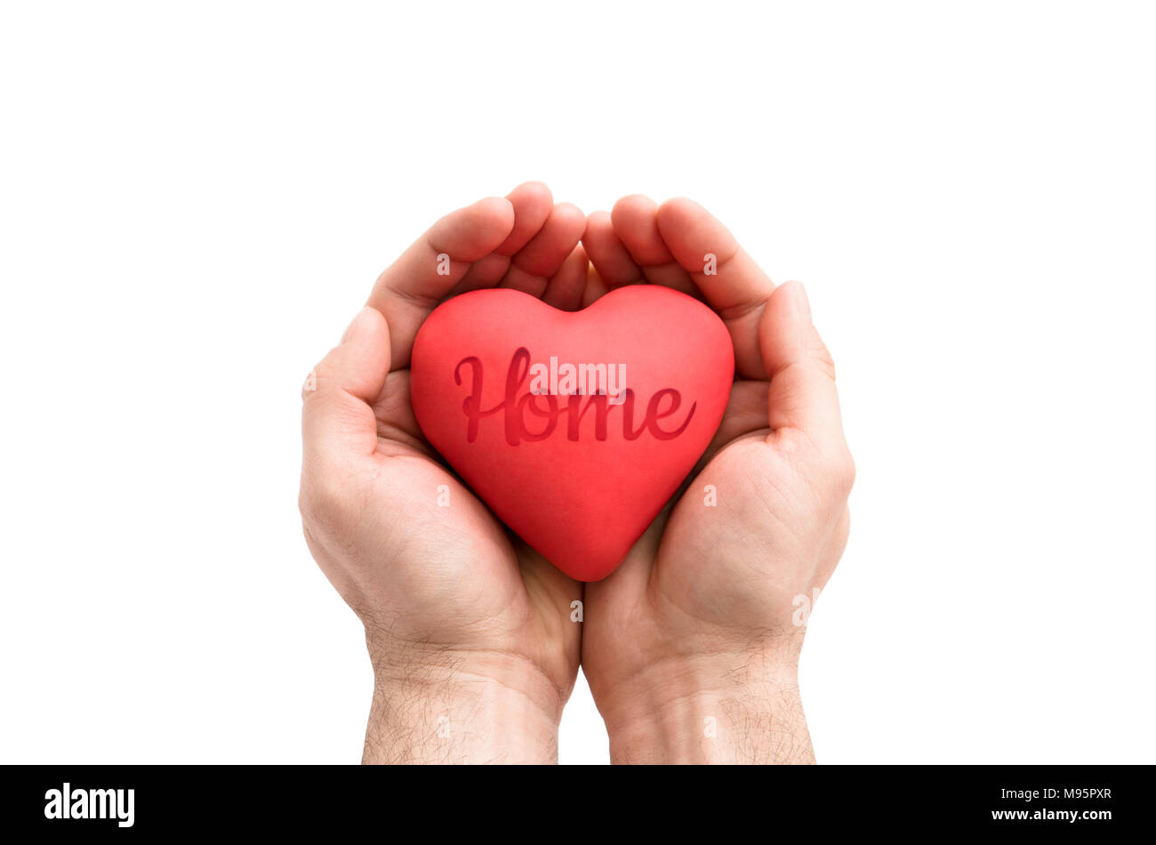 Red heart with imprinted home word in man's hands. Stock Photo