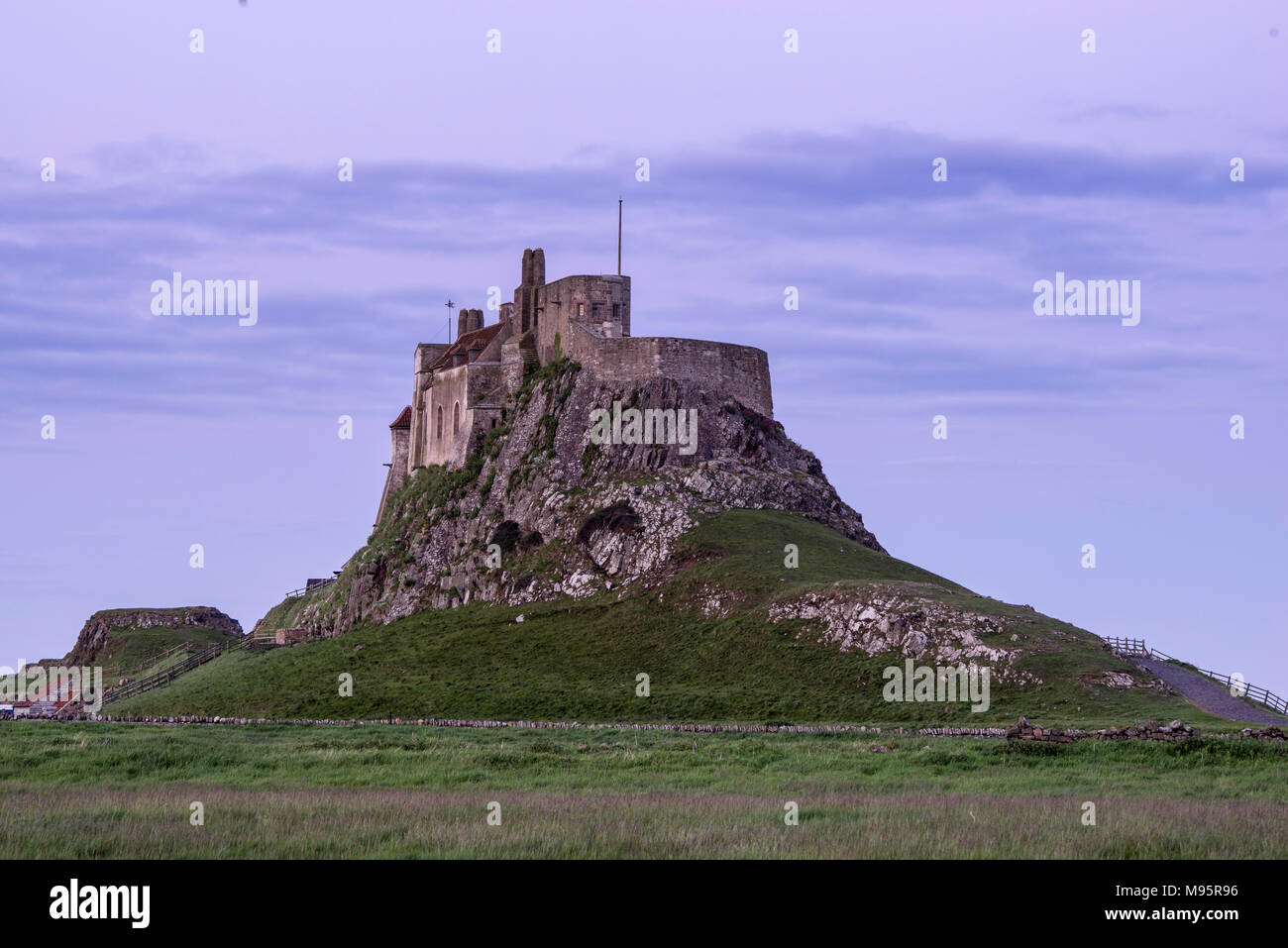 Lindisfarne castle on a cloudy Summer's evening.  Holy Island, Northumberland, England, UK Stock Photo