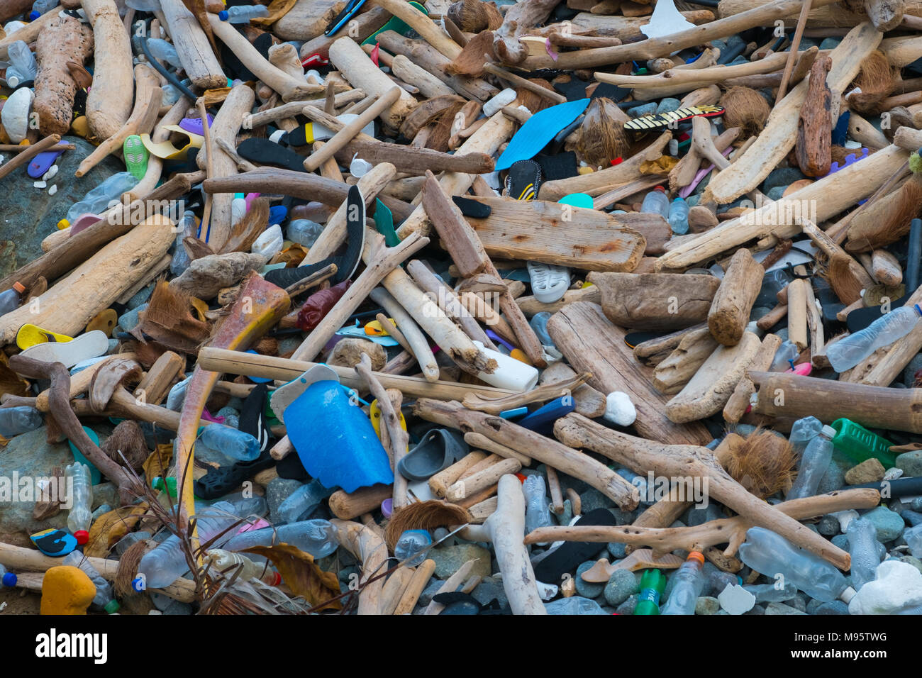 ocean pollution - trash and waste on  polluted beach closeup  - Stock Photo