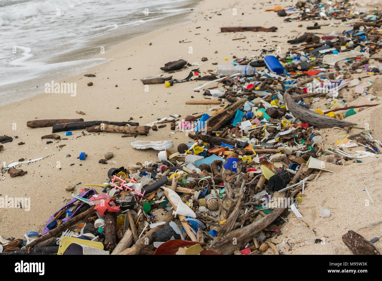 polluted beach  - plastic waste, trash  and garbage closeup - Stock Photo