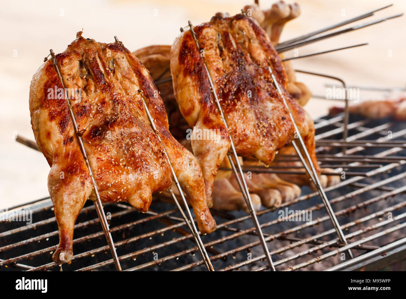 Roasted chicken on barbecue grills Stock Photo Alamy