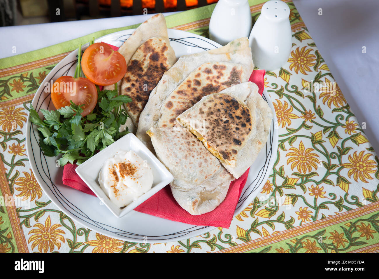 Traditional Azerbaijani pie/Qutab with a cheese and herb filling served