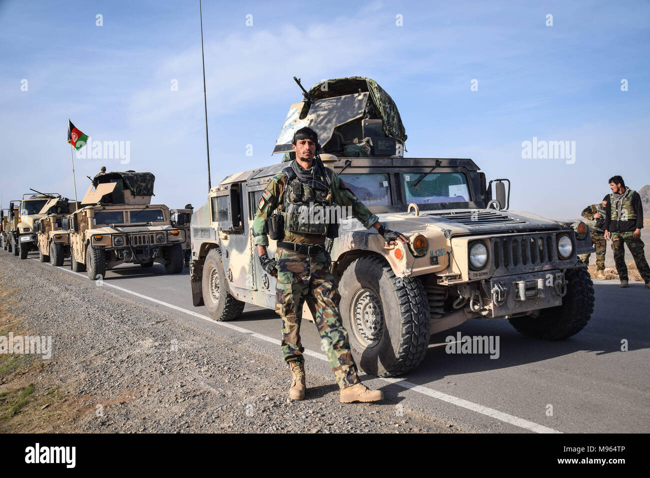 Afghan Commando in front of a HMMWV, somewhere on the main road in Farah province. Afghanistan’s elite military forces – the Commandos and the Special Forces are one of the key elements in the Afghan and U.S. strategy to turn the grinding fight against the Taliban and other insurgents around. These pictures show the Commandos and Special Forces during training and in the field; also right before and after an operation in the restive western Afghan province of Farah. Stock Photo