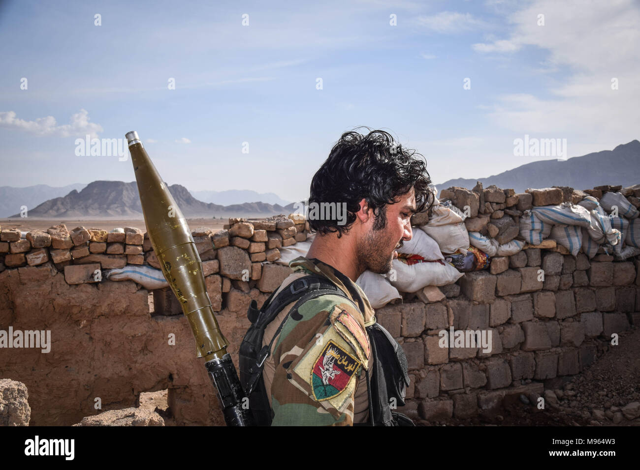 Afghan Commando with an RPG in the remains of an Afghan National Defence and Security Forces Outpost behind Farahrud Bazaar, just off the main road in Bolo Bluk district, Farah province. According to Afghan Commandos the outpost had been recently overrun and razed by Taliban who hold a nearby village. Afghanistan’s elite military forces – the Commandos and the Special Forces are one of the key elements in the Afghan and U.S. strategy to turn the grinding fight against the Taliban and other insurgents around. These pictures show the Commandos and Special Forces during training and in the field; Stock Photo