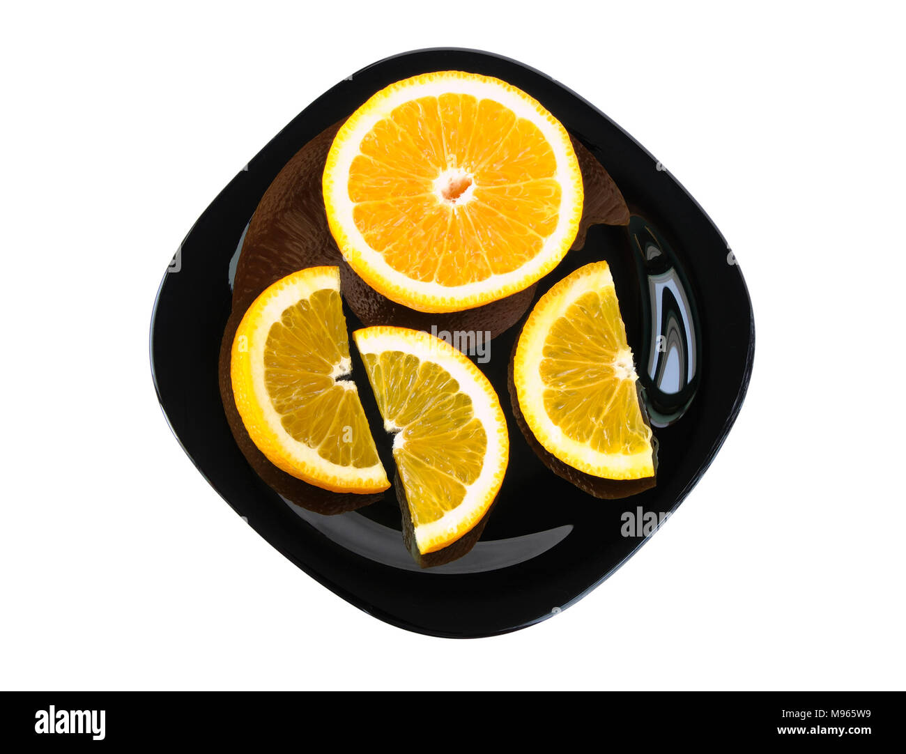 Slices of orange on a plate on white background Stock Photo