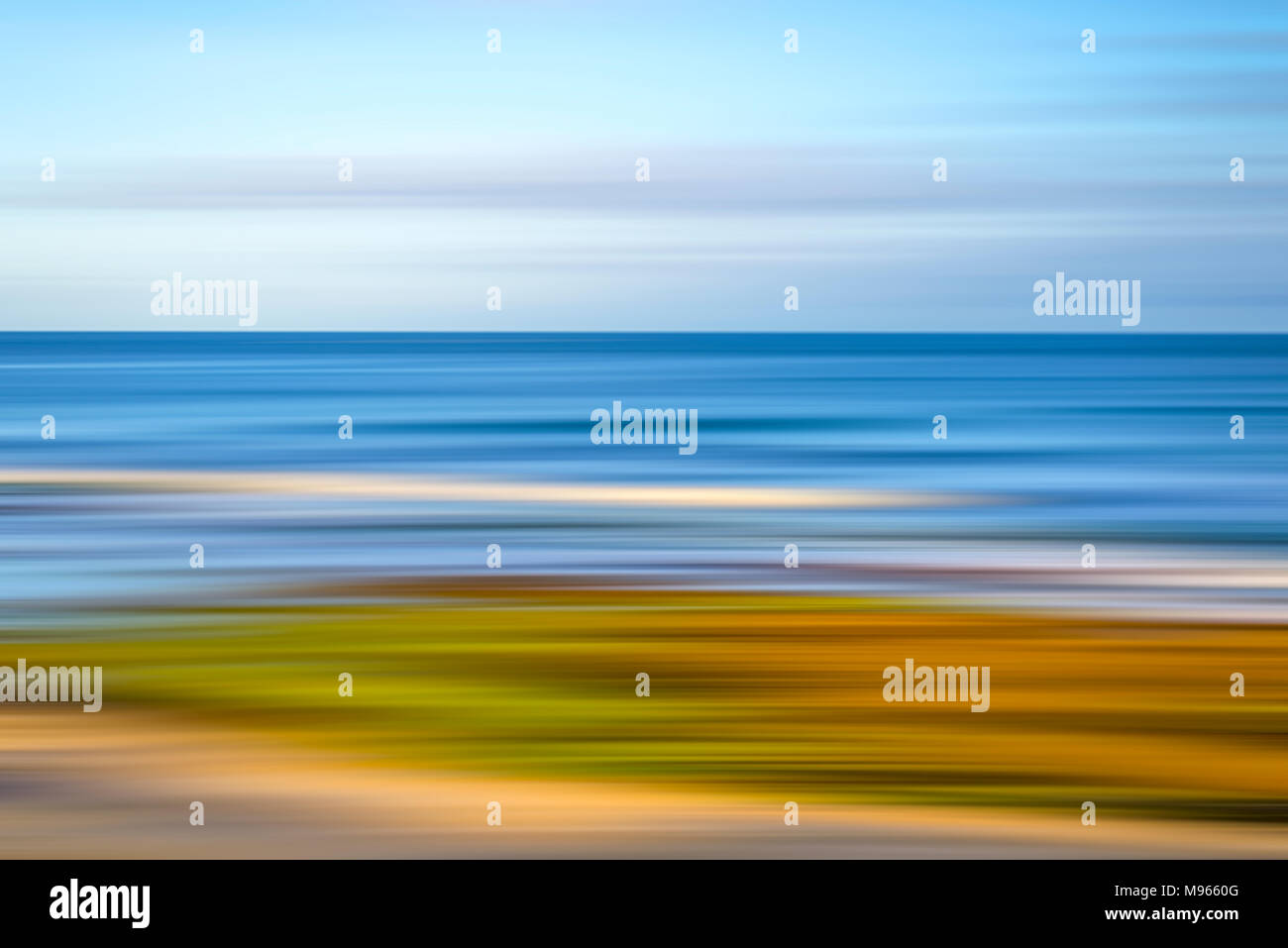 Coastal scene, ocean and beach. Motion blur effect, Impressionistic photography. Stock Photo