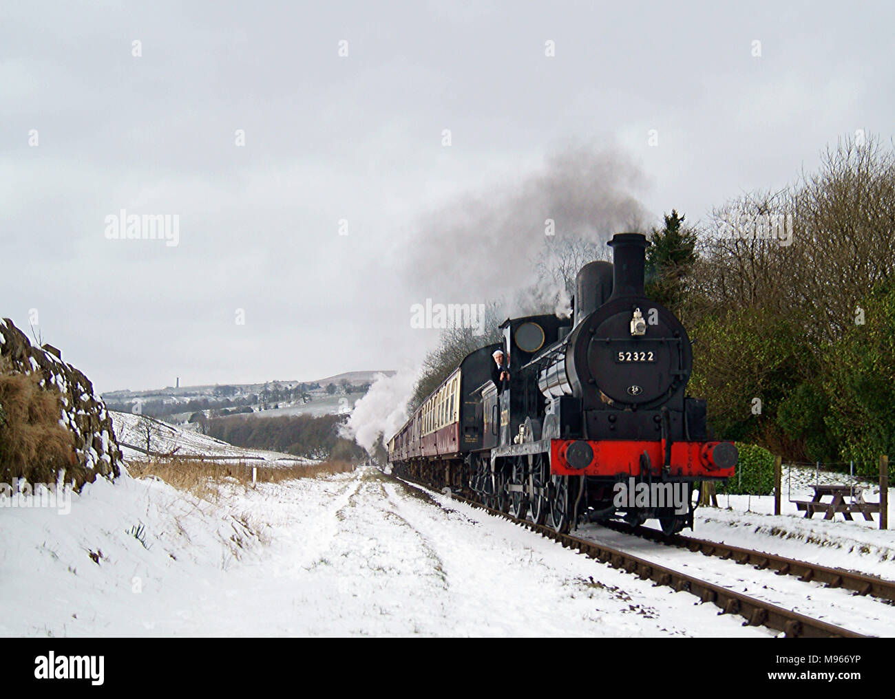 Steaming through the snow on East Lancs Railway Stock Photo