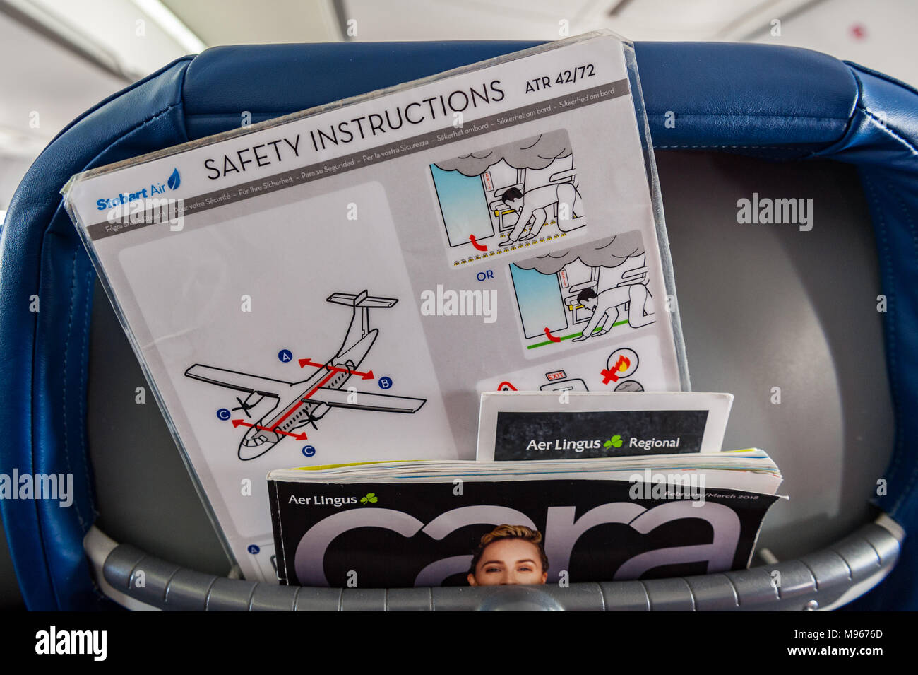 Safety card and inflight magazine on an Aer Lingus/Stobart Air ATR 72-600 aircraft. Stock Photo