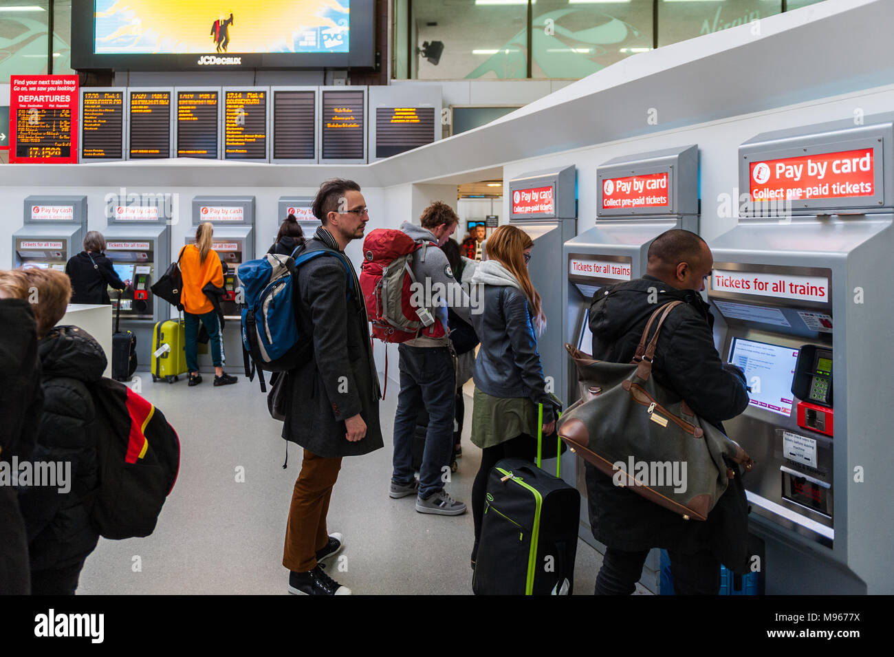 Passengers buying train tickets at Birmingham International Railway Station, Marston Green, Birmingham, West Midlands, UK. Stock Photo