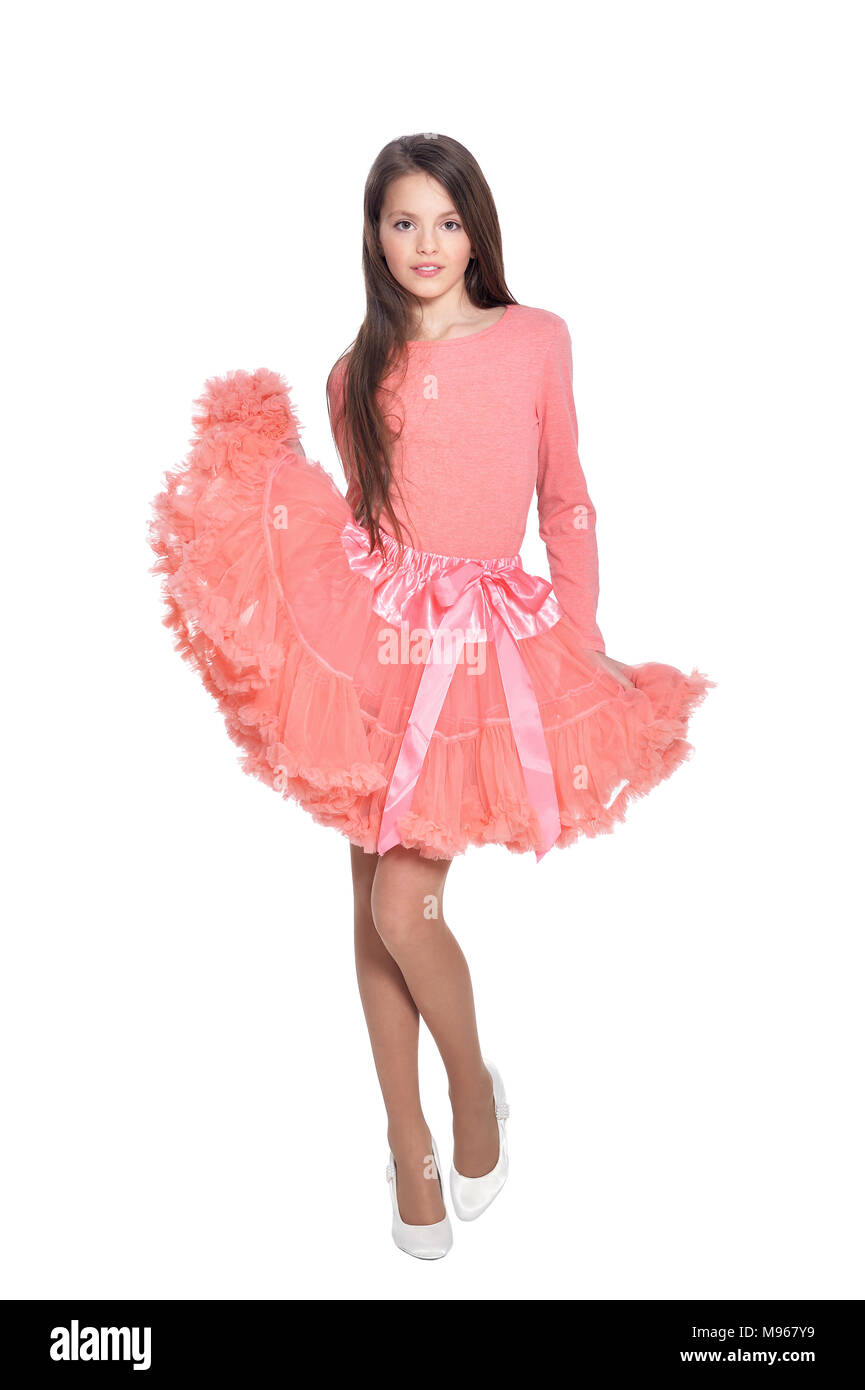 Happy little girl in pink dress posing isolated on white background ...