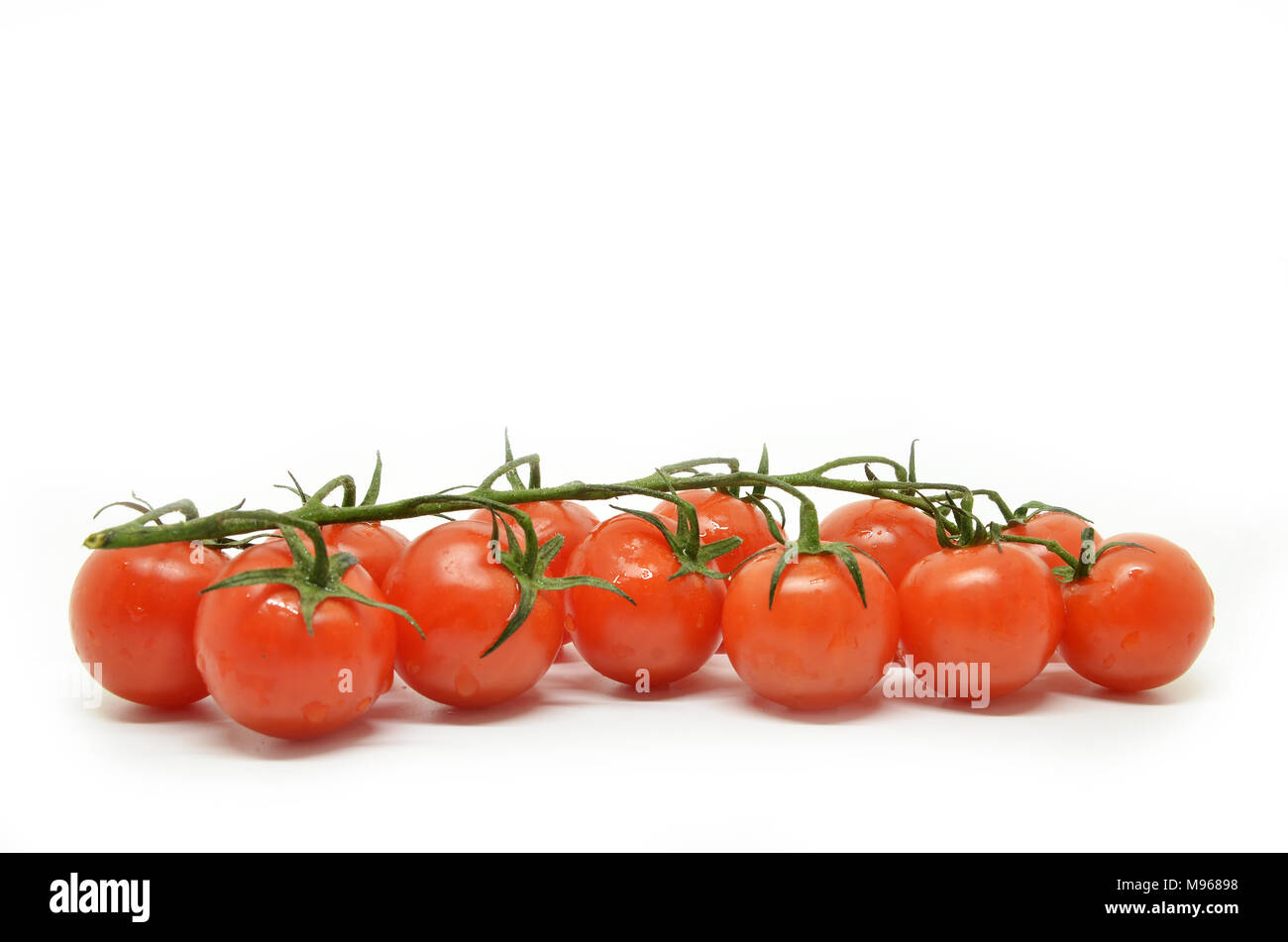 Red cherry tomato isolated on white background Stock Photo - Alamy