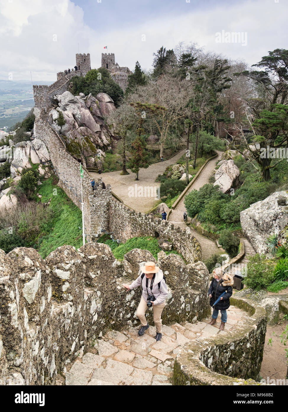 3 March 2018: Sintra, Portugal - Tourists explore the Castle of the Moors at Sintra, Portugal, on an early spring day. Stock Photo