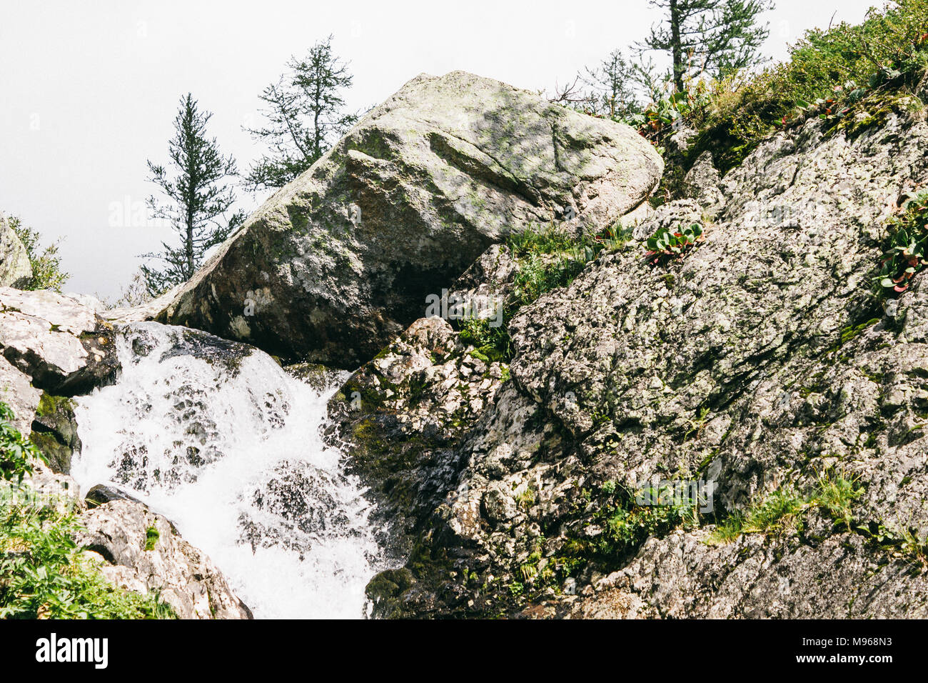 Mountain Rocks Strream Mountain waterfall in the rocks. Mountain stream, adventure in the ...