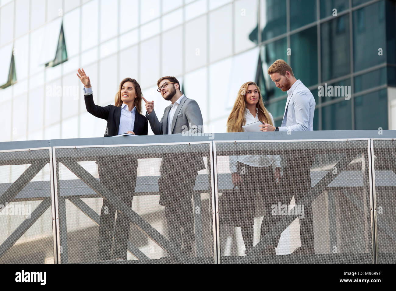 Business people and colleagues talking outdoors Stock Photo - Alamy