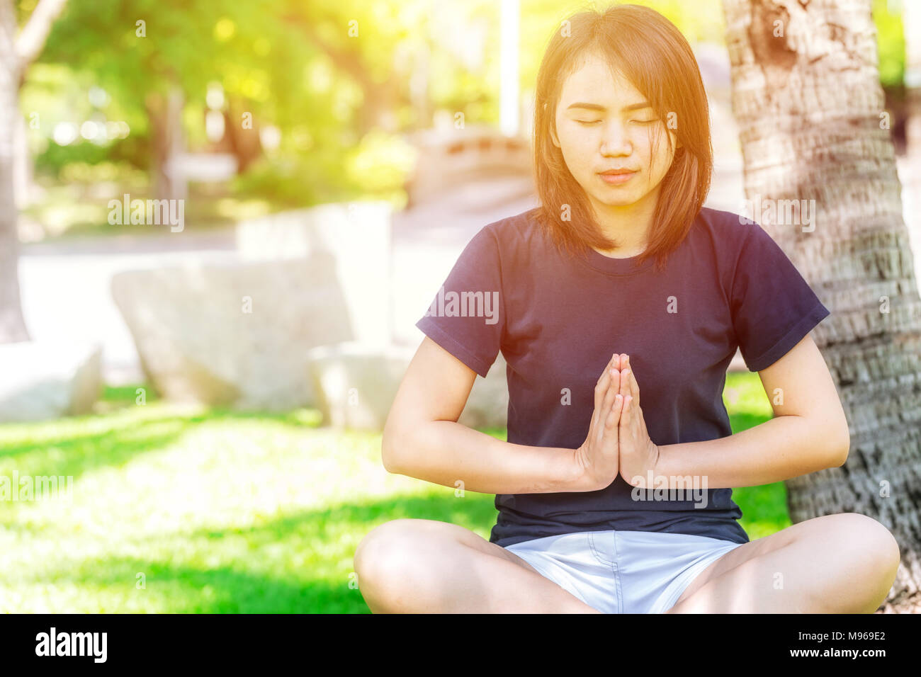 Teen Outdoor Yoga relax and concentration with nature peace for mental health Stock Photo