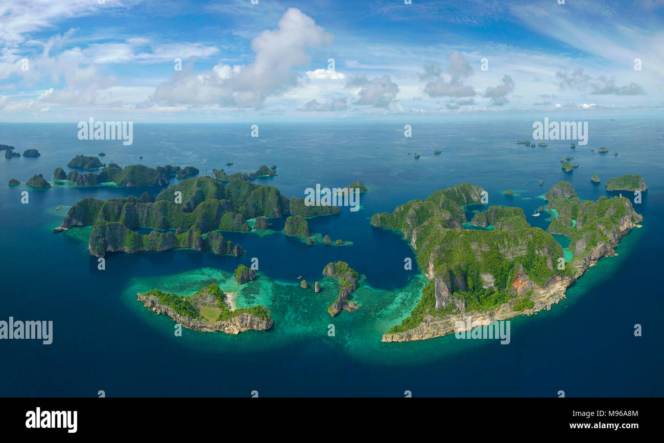 A panoramic drone photo of the beautiful islands at Balbulol in Misool in Raja Ampat Marine Park, West Papua, Indonesia. Stock Photo