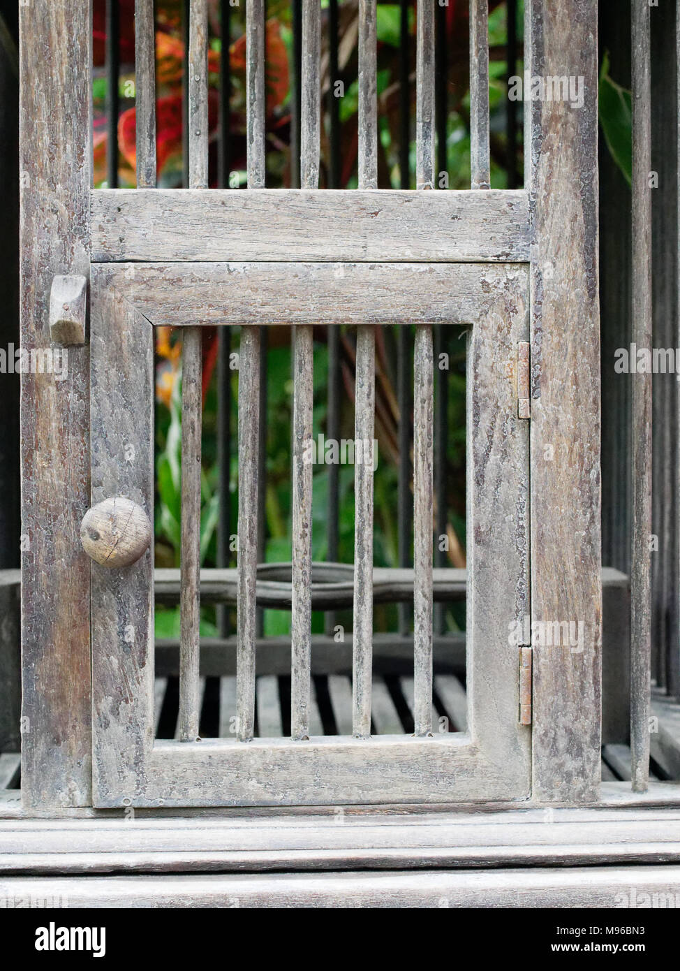 Door of empty wooden bird cage in retro style show concepts of entrance, taking chance, security, conceptual and imagination block, and trap Stock Photo