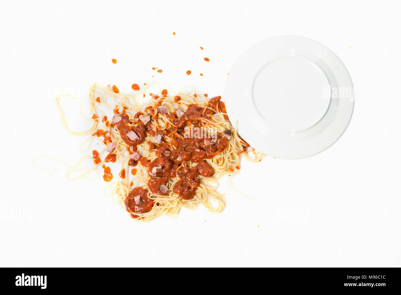 A fallen dish of pasta on the floor Stock Photo