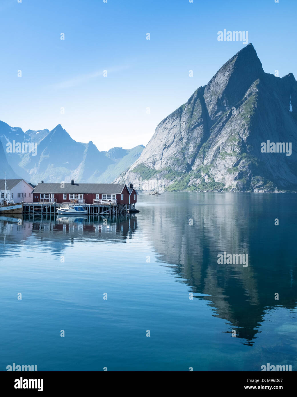 Scenic landscape with mountains and idyllic village at bright summer day in Lofoten Islands, Norway Stock Photo