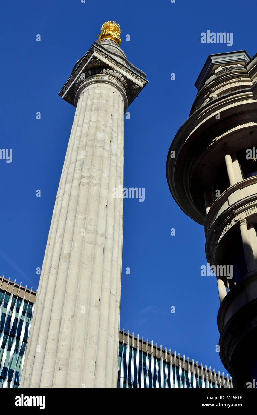 London, England, UK. Monument (to the Great Fire of London) at the junction of Monument Street and Fish Street Hill (Doric column - 1677: Sir Christop Stock Photo