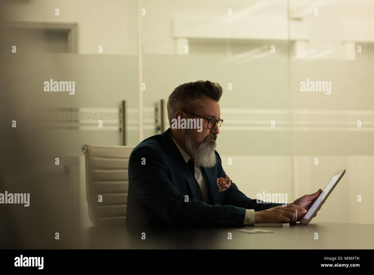 Business executive using digital tablet Stock Photo