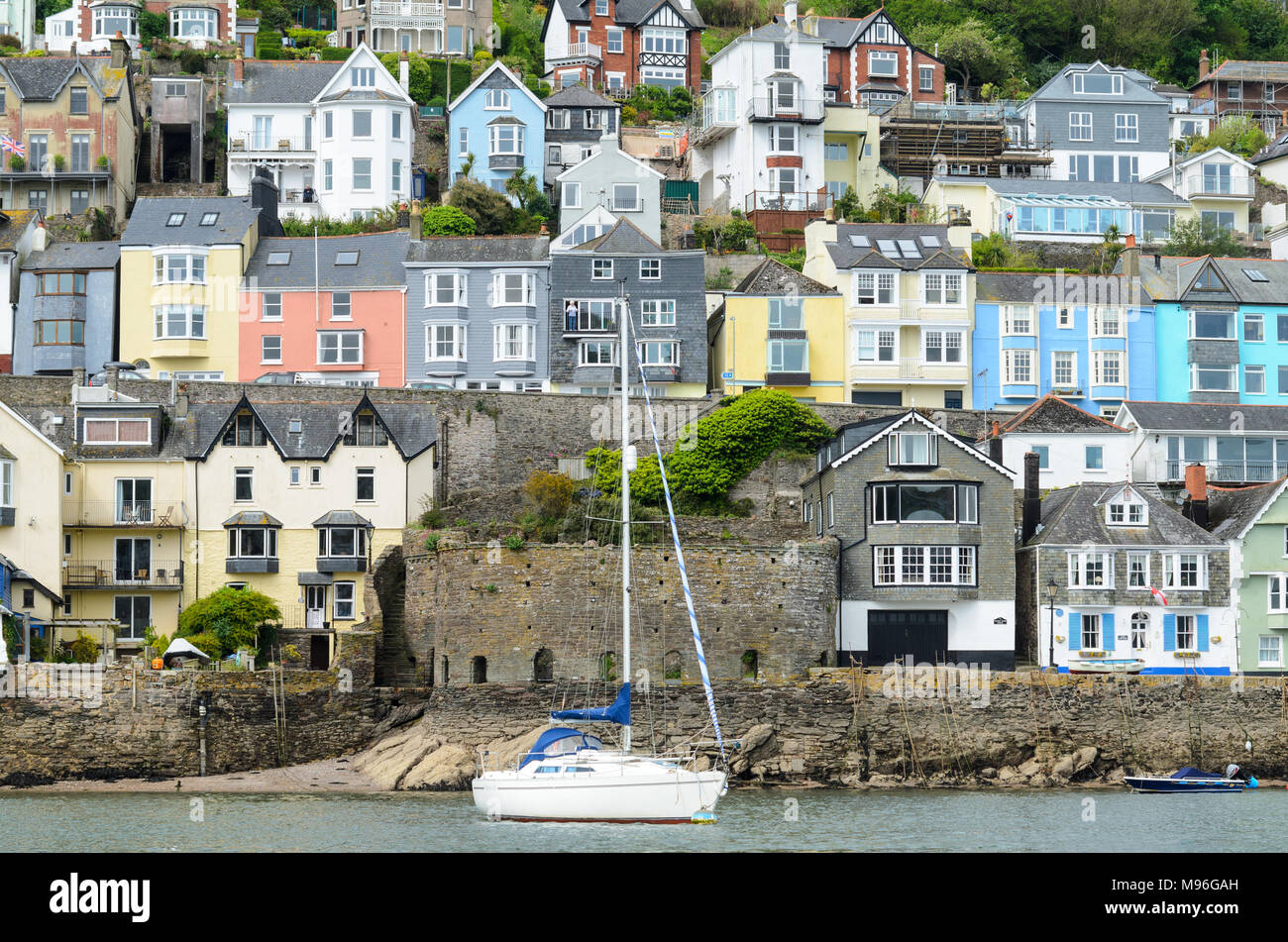 Multicoloured houses lining the banks of the RIver Dart in Devon Stock Photo Alamy
