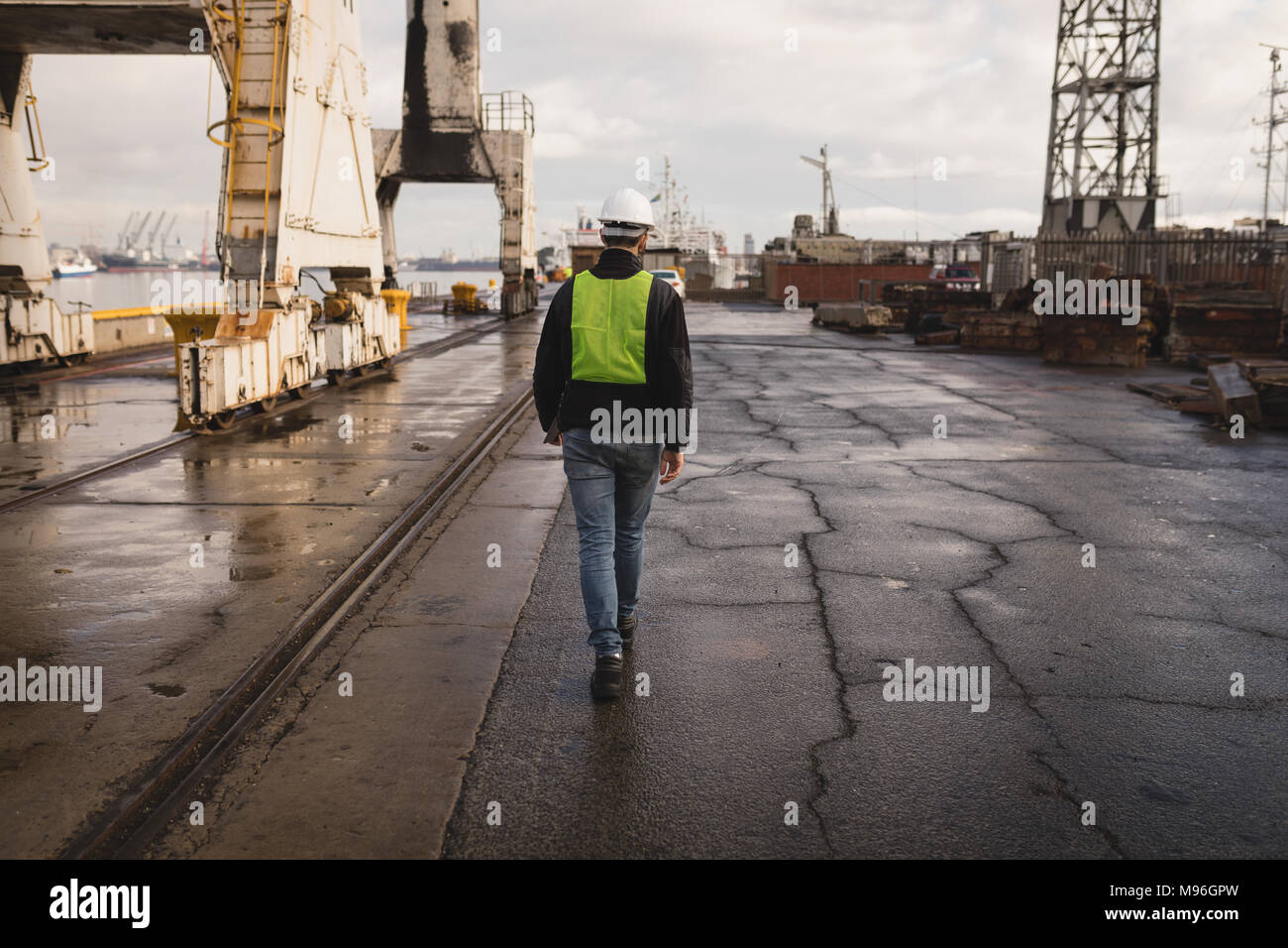 Dock worker walking in the shipyard Stock Photo