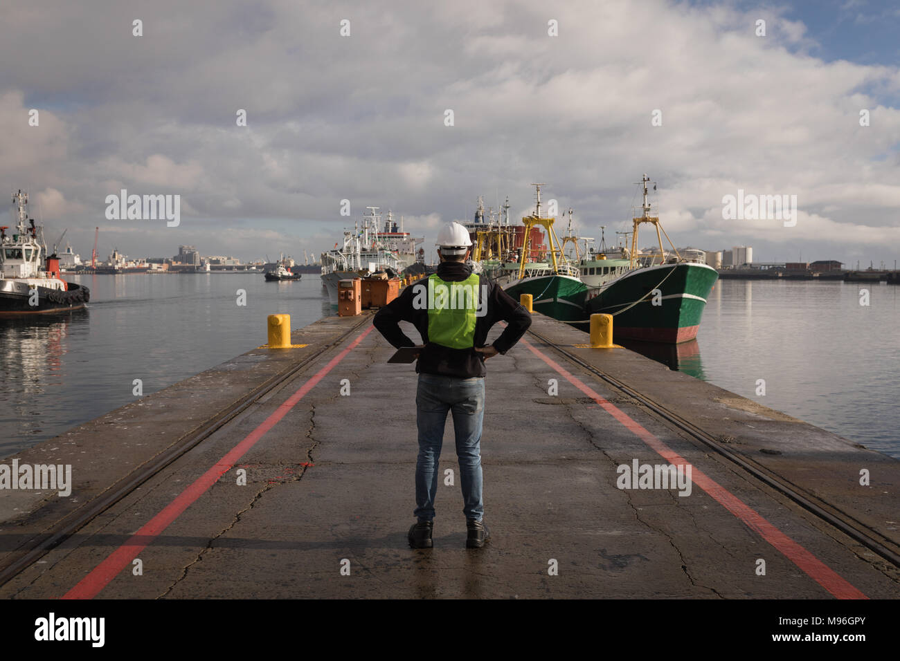 Dock worker standing in the port Stock Photo