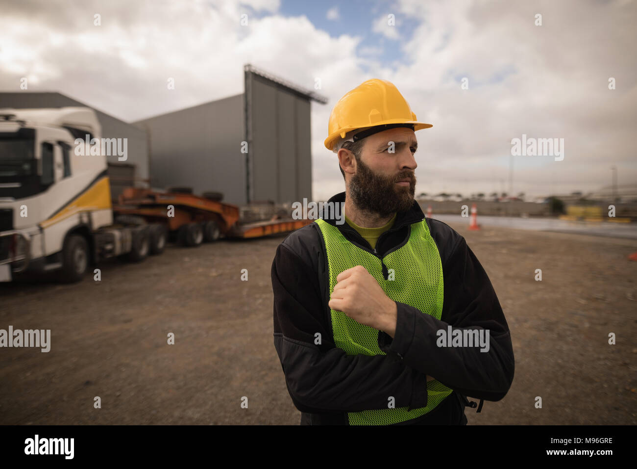 Dock worker standing in shipyard Stock Photo