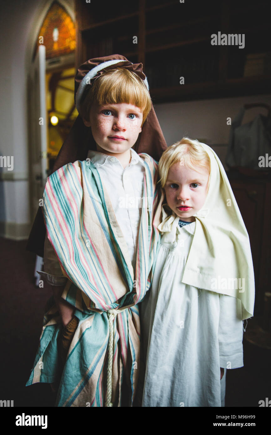 Children looking at camera in pageant costumes Stock Photo - Alamy