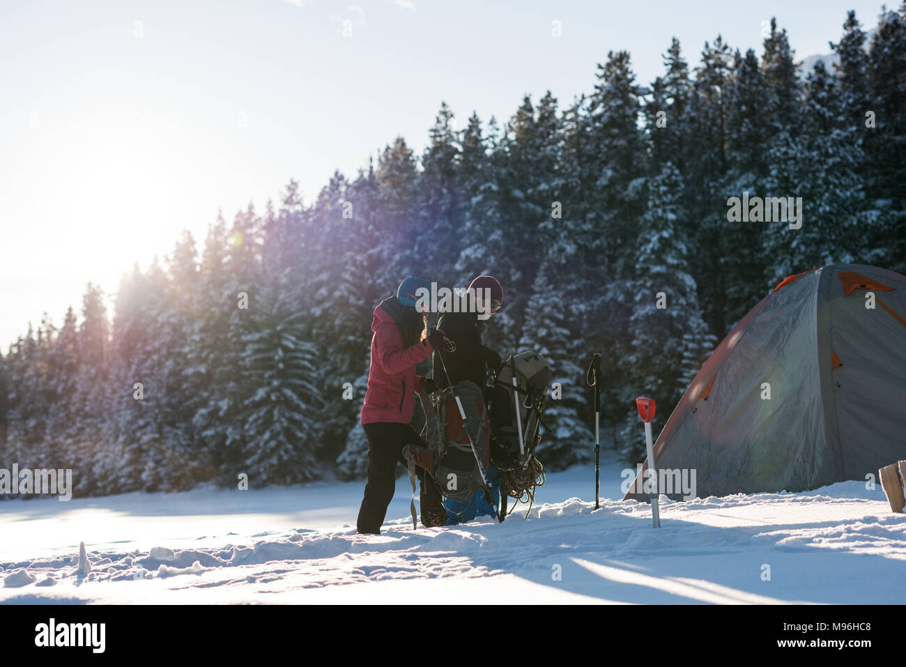 Couple walking together in snowy landscape Stock Photo