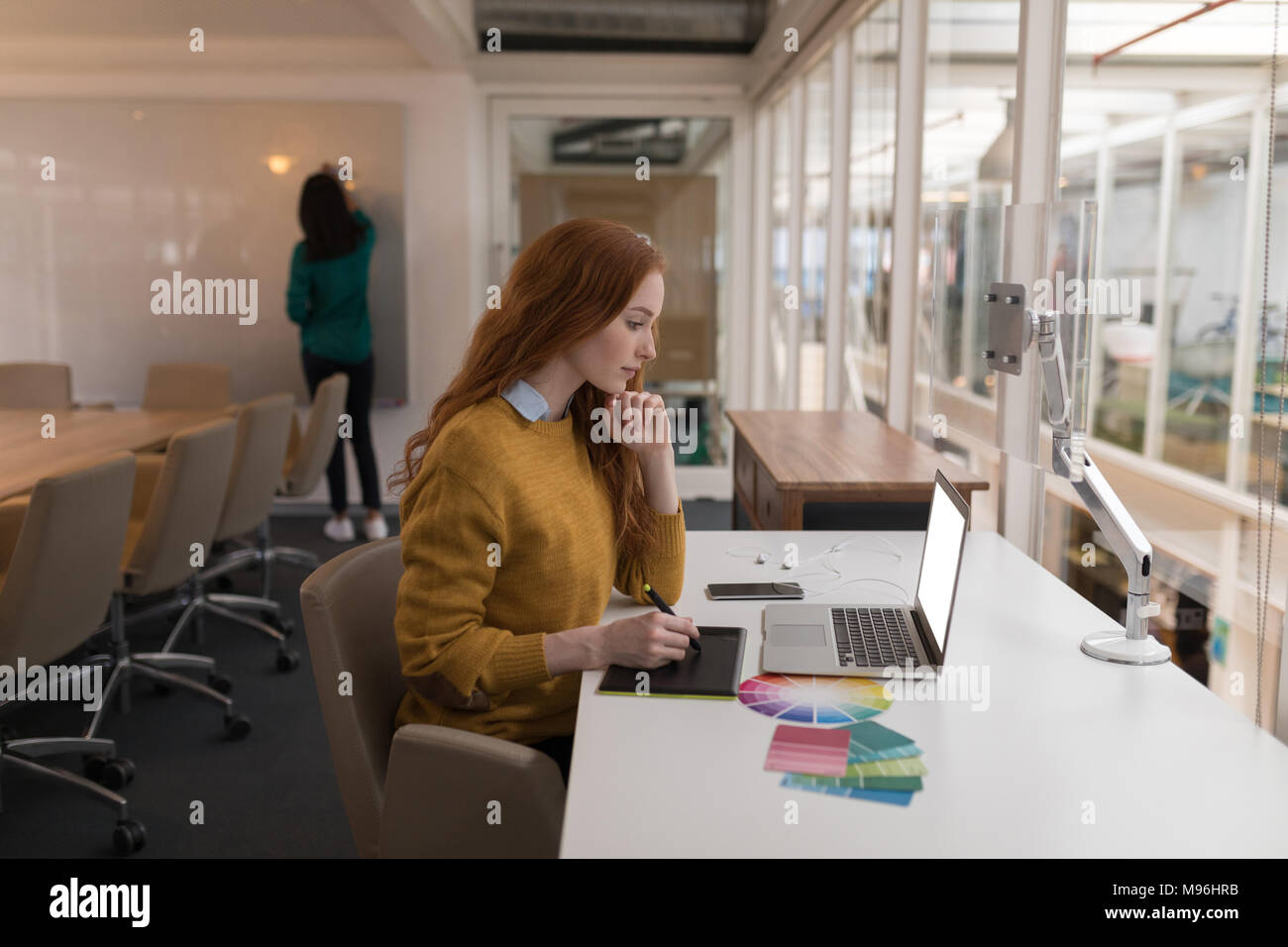 Female graphic designer using graphics tablet Stock Photo