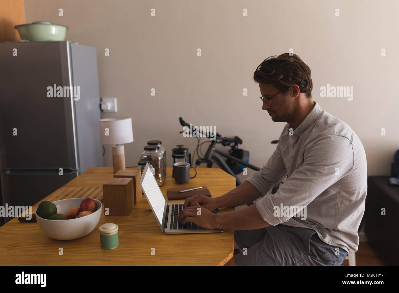 Man using laptop at home Stock Photo