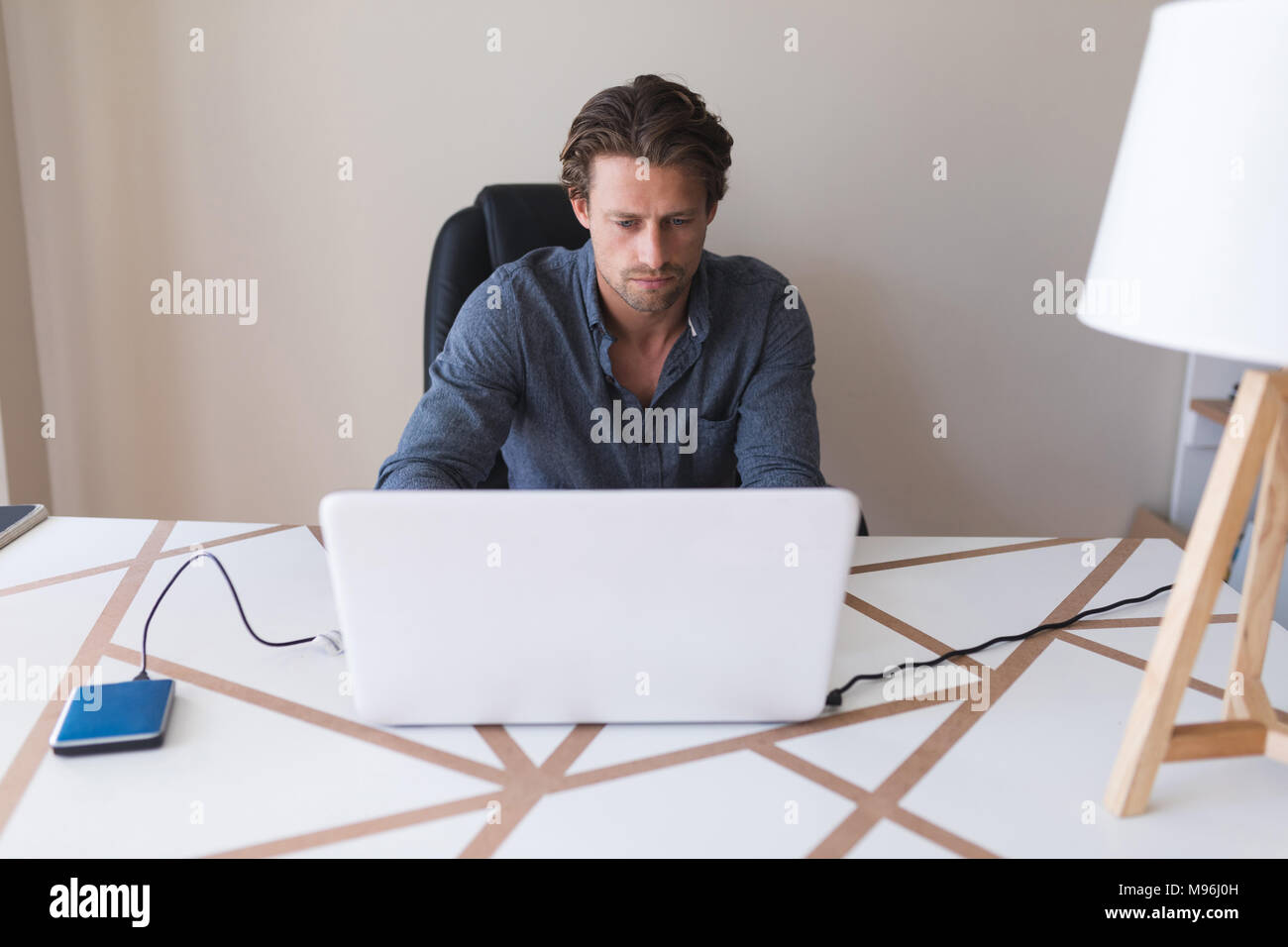 Man using laptop at home Stock Photo