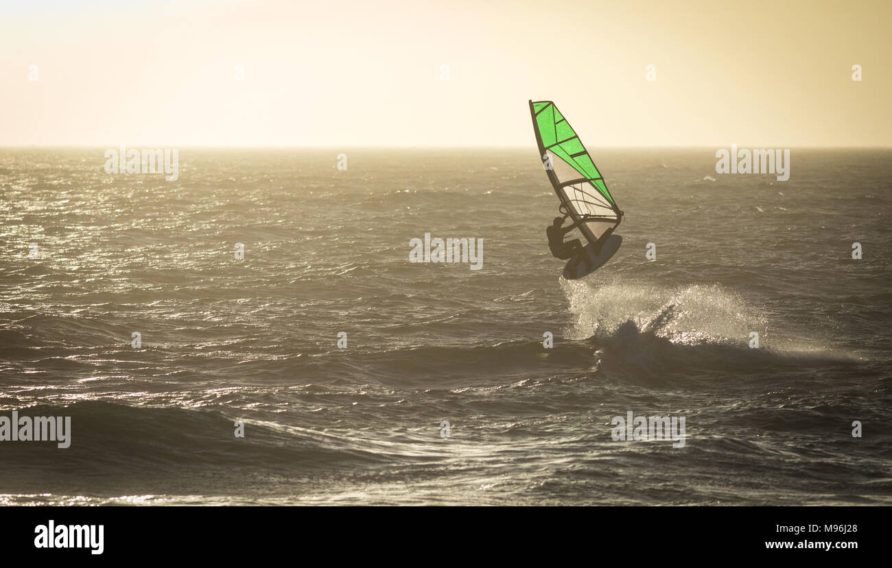 Male surfer surfing with surfboard and kite Stock Photo Alamy