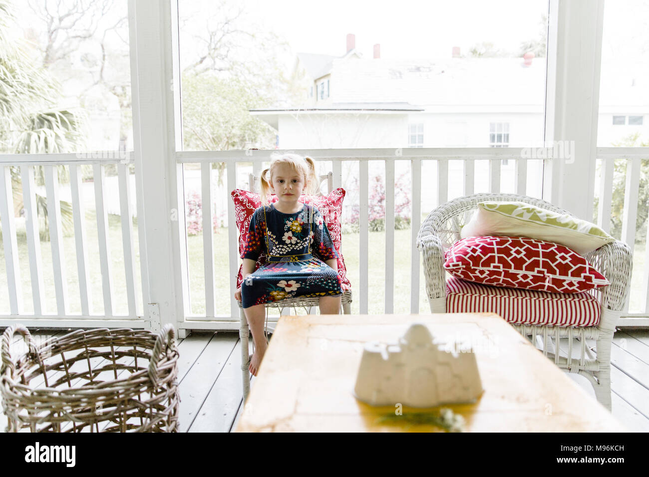 Girl sitting on porch hi-res stock photography and images - Alamy