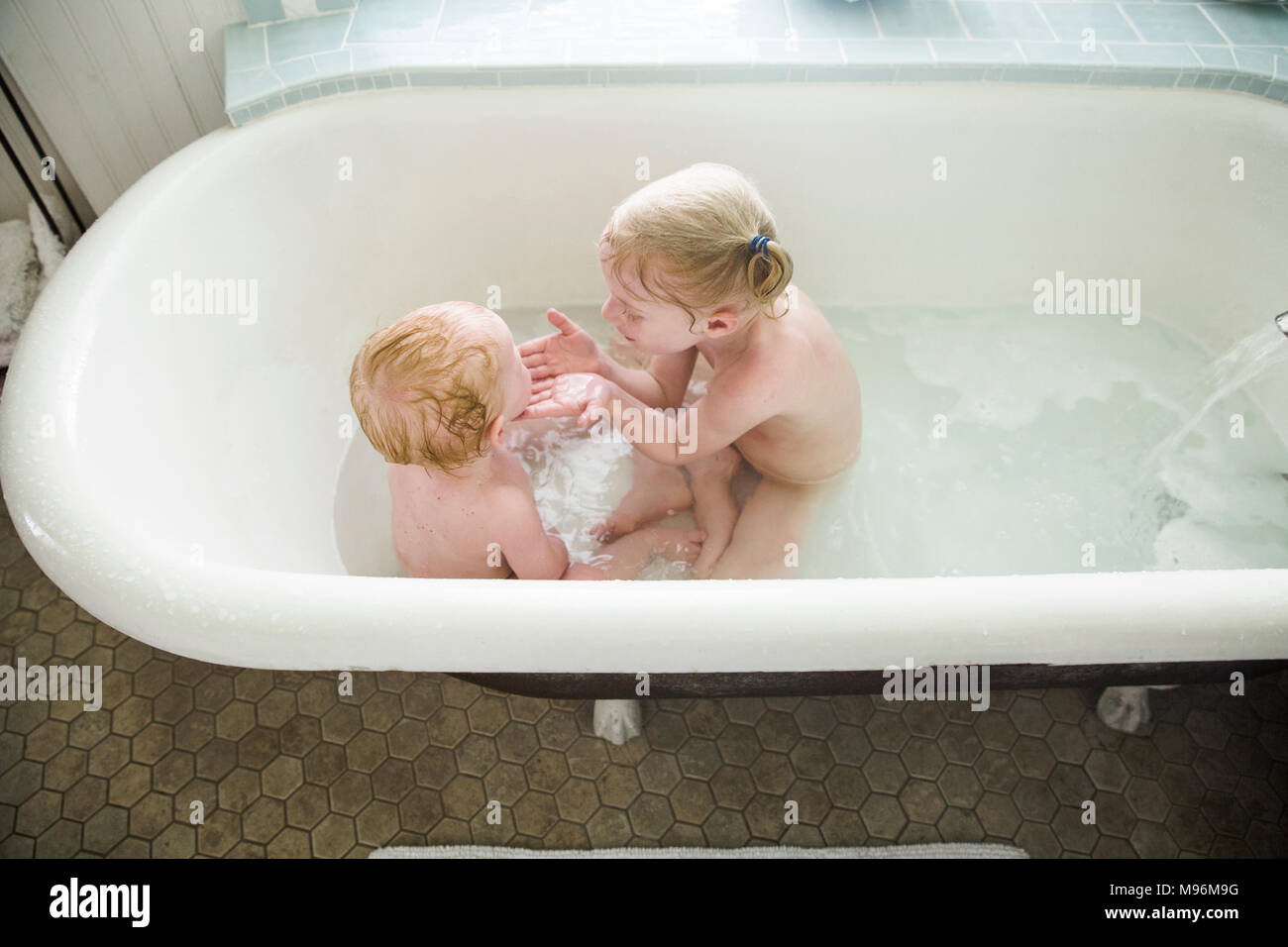 Siblings bathing together hires stock photography and images Alamy
