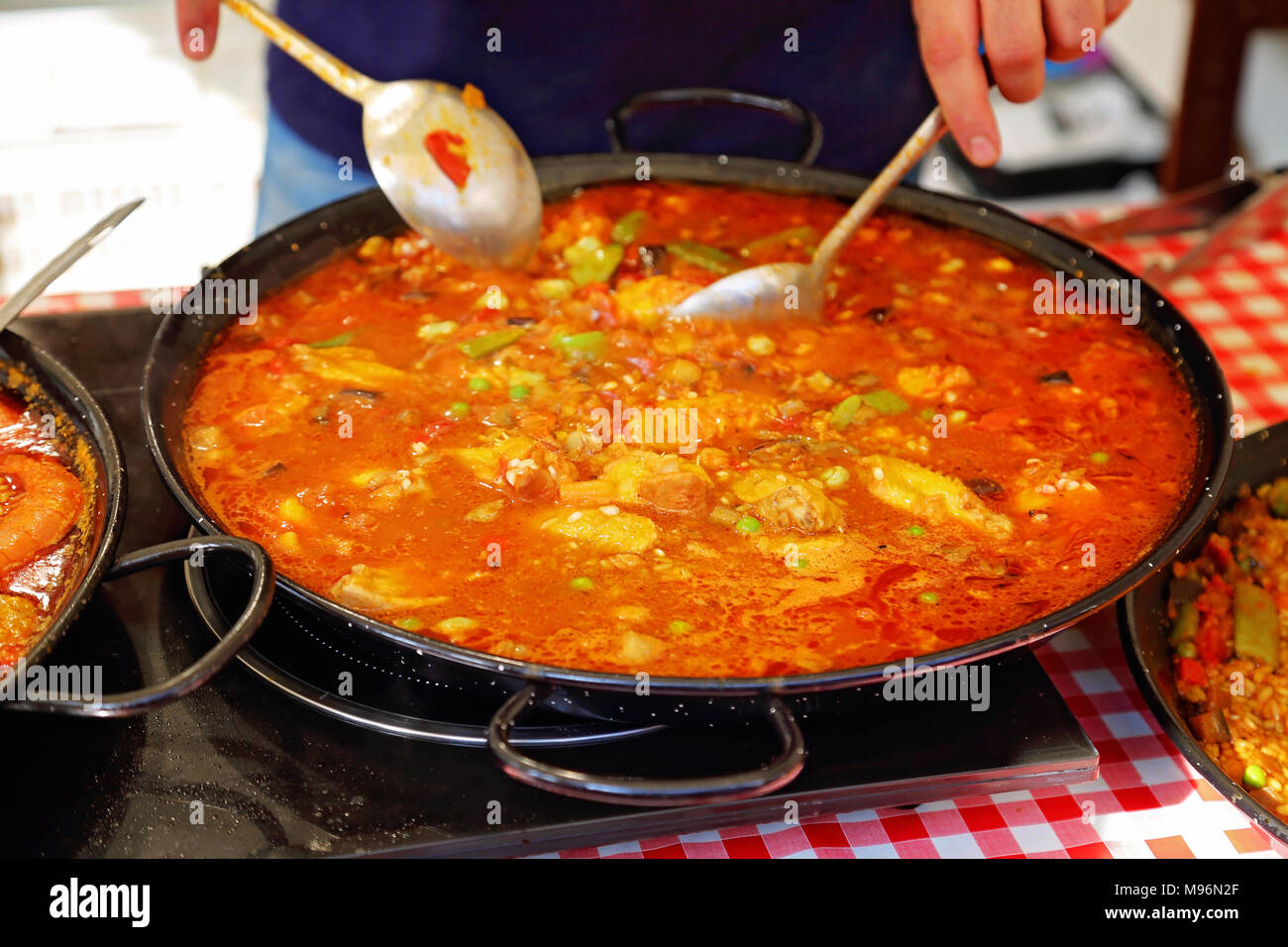 Paella preparation street market stand near Barcelona Cathedral