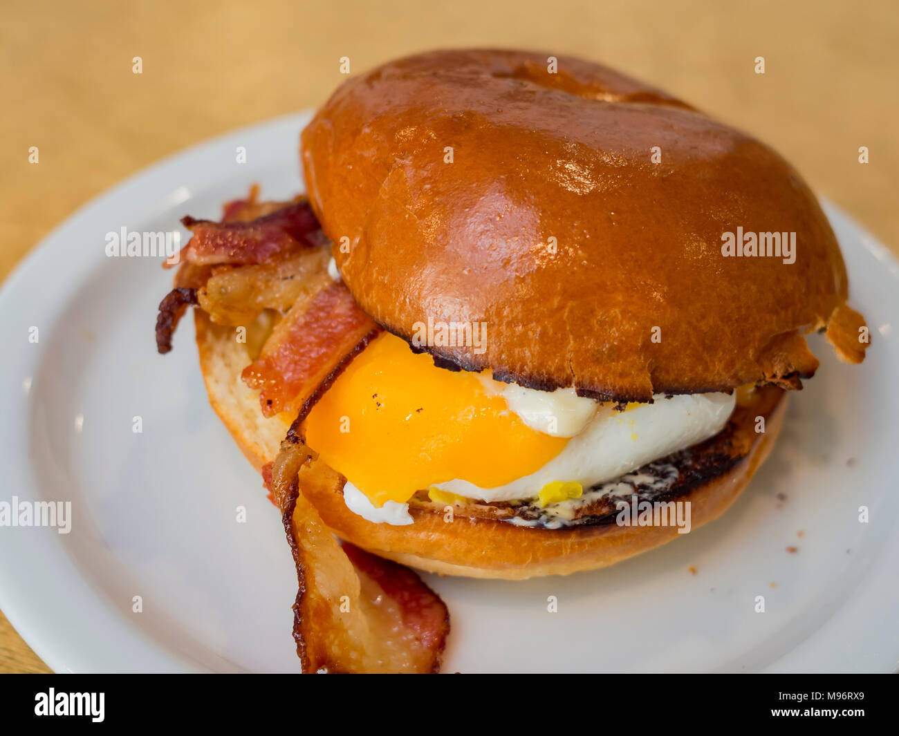 Close up shot of bacon sandwich with eggs, ate at Los Angeles Stock