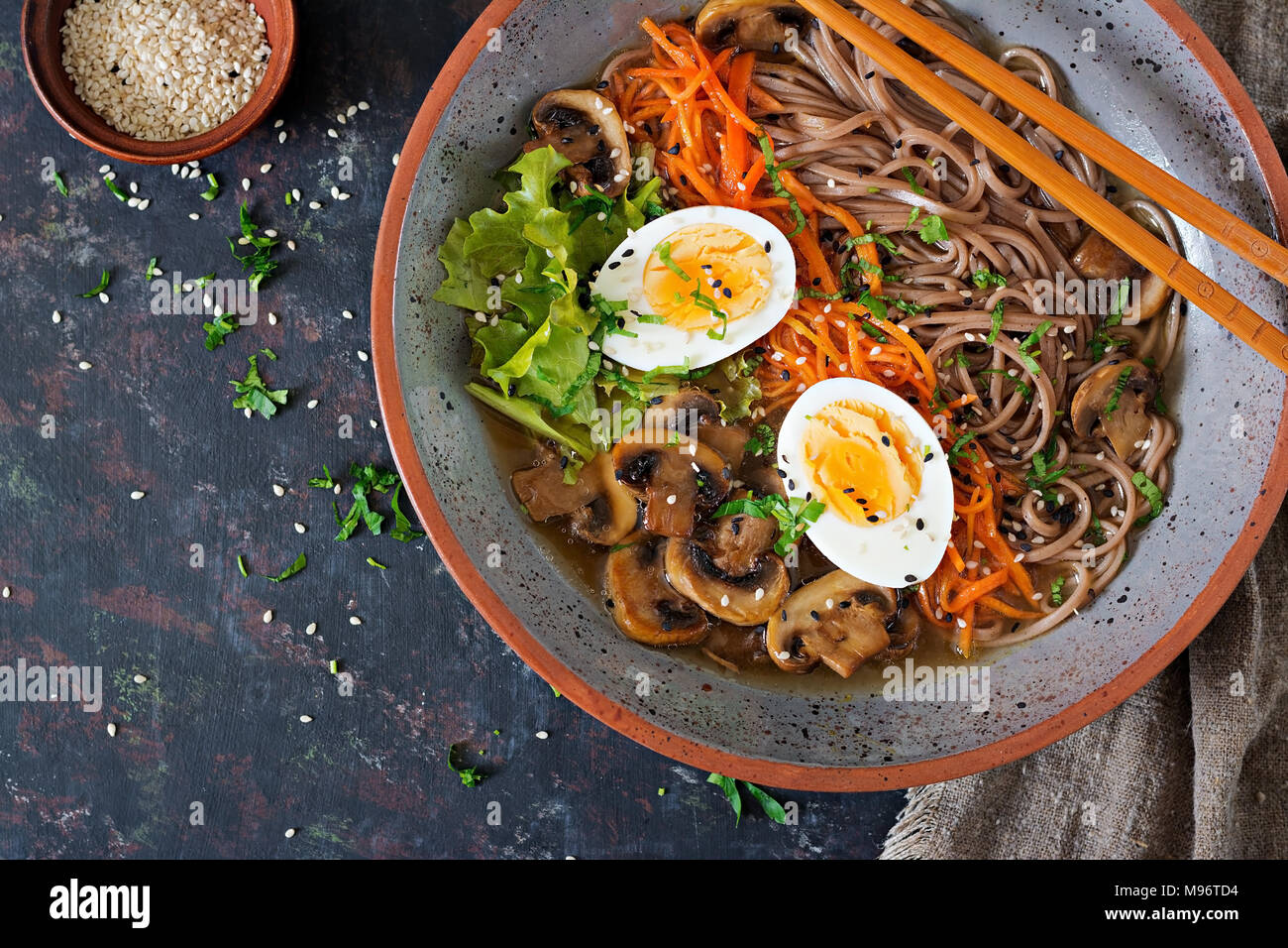 Japanese miso ramen noodles with eggs, carrot and mushrooms. Soup delicious food. Flat lay. Top view Stock Photo