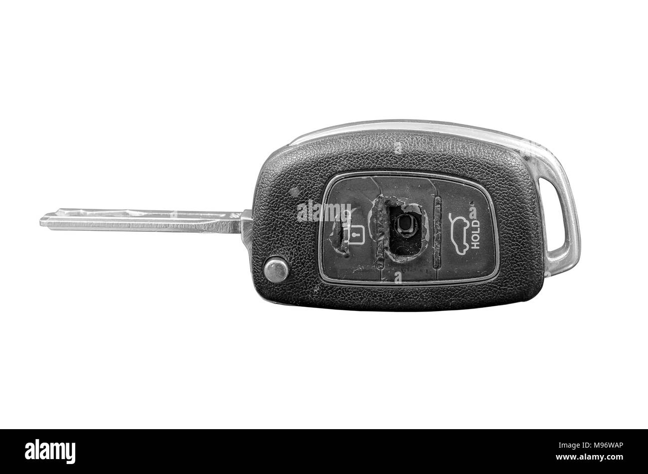 Close-up of a damaged car key isolated on white background. Stock Photo