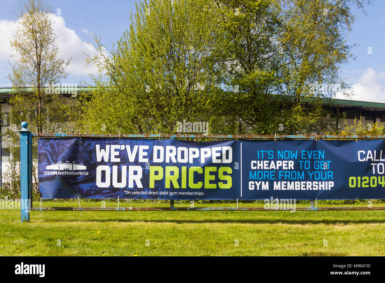 Gym membership advertising banner outside Bolton Arena indoor sports arena at Middlebrook Retail and Leisure Park, Horwich. Stock Photo
