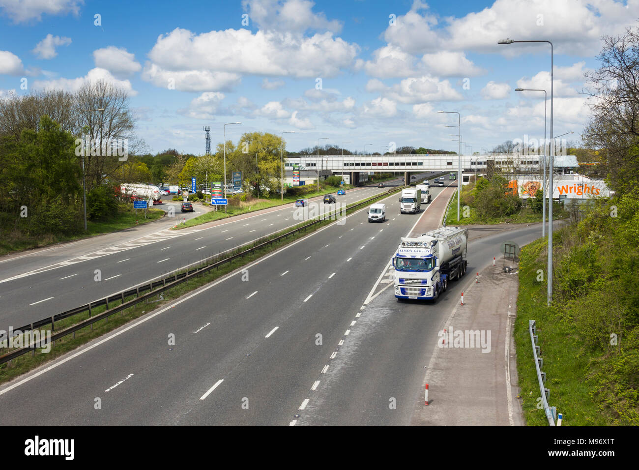M6 motorway in Lancashire at Charnock Richard services, looking north with Simon Gibson tanker joining the southbound carriageway. Stock Photo
