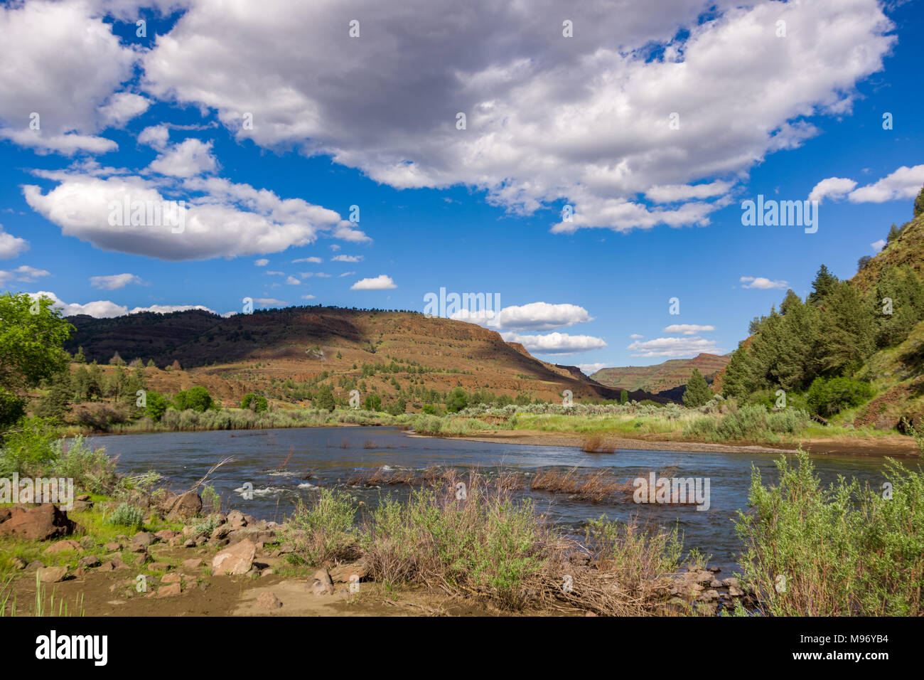 A riverbend in the John Day River, near Spray Oregon. Low clouds create shadows on a nearby hill. Stock Photo