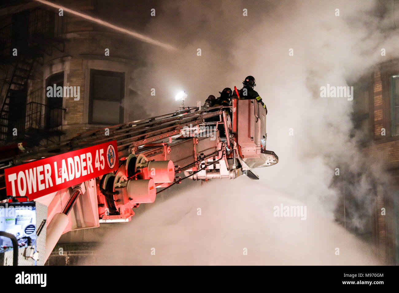 New York, New York, USA. 23nd Mar, 2018. A fire struck the basement of a building where it was a movie set from Motherless Brooklyn's film director Edward Norton at 401 St. Nicholas Avenue in Hamilton Heights on Manhattan Island in New York City early in the morning of this Friday, 23. No information of injuries. Credit: William Volcov/ZUMA Wire/Alamy Live News Stock Photo