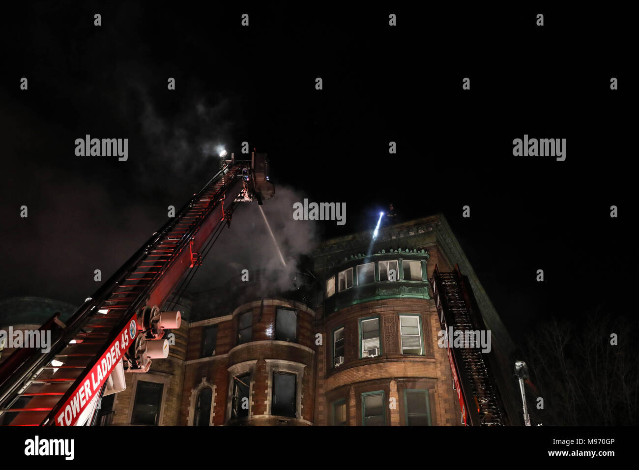 New York, New York, USA. 23nd Mar, 2018. A fire struck the basement of a building where it was a movie set from Motherless Brooklyn's film director Edward Norton at 401 St. Nicholas Avenue in Hamilton Heights on Manhattan Island in New York City early in the morning of this Friday, 23. No information of injuries. Credit: William Volcov/ZUMA Wire/Alamy Live News Stock Photo