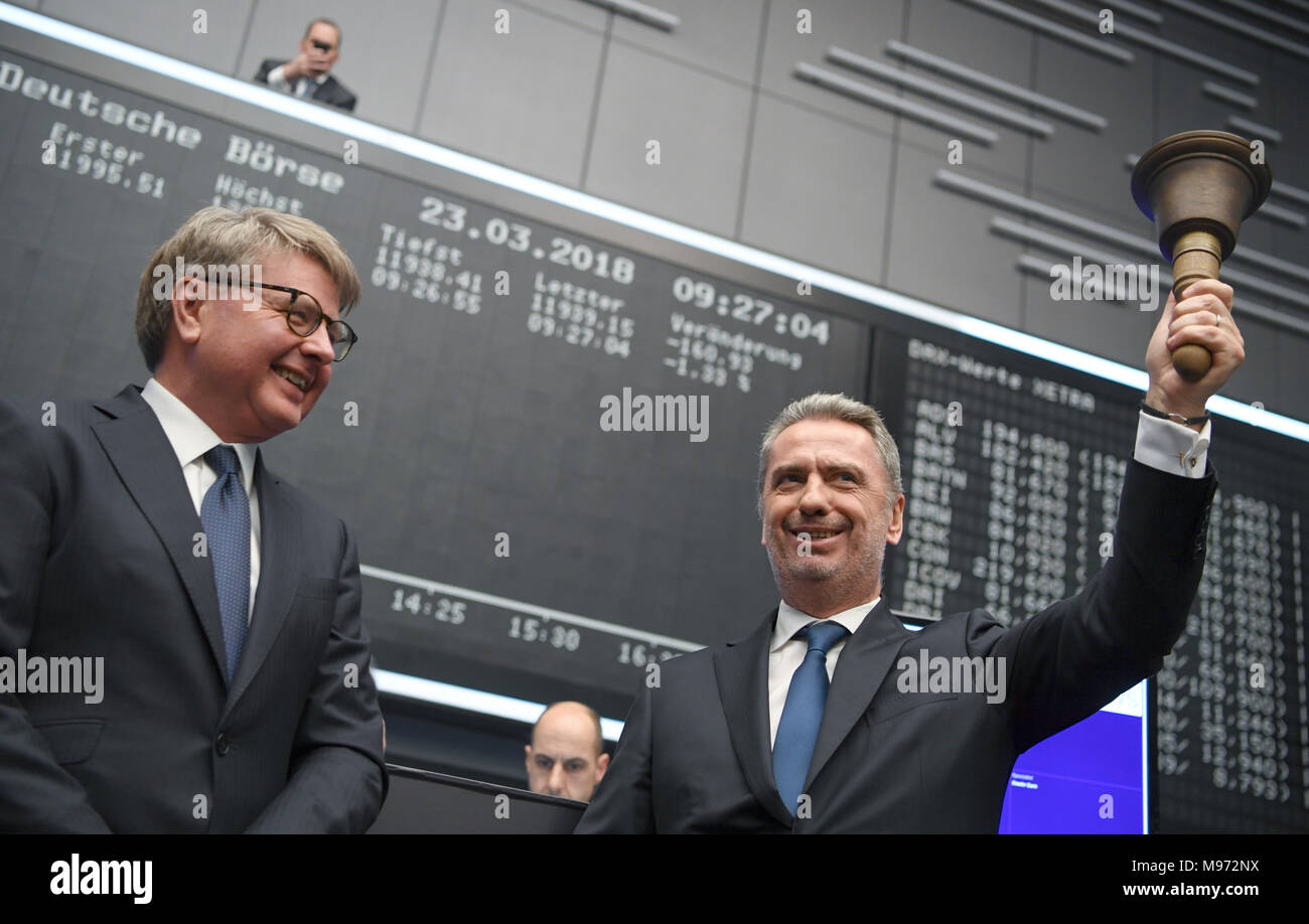 Frankfurt/Main, Germany. 23 March 2018, Nicolas Moreau (r), CEO of the DWS  Group, rings the stock exchange bell to announce the flotation of his  company at the Frankfurt stock exchange. The Deutsche