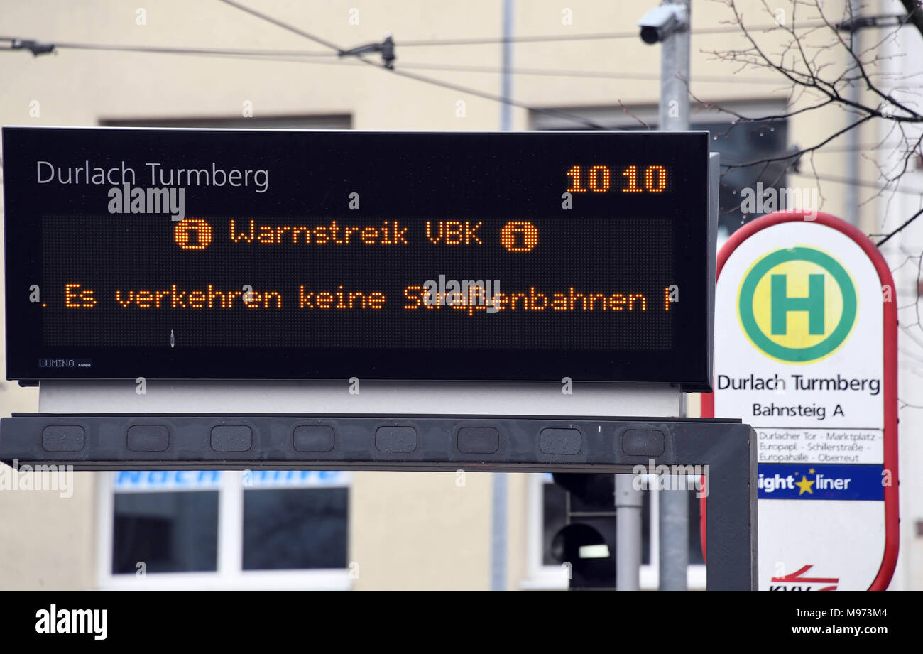 23 March 2018, Germany, Karlsruhe: Transport information boards read 'Warnstreik' (lit. 'warning strike'). Labour union Verdi calls for a general warning strike on Monday to affect multiple public services, including day-cares, hospitals and waste removal. Photo: Uli Deck/dpa Stock Photo