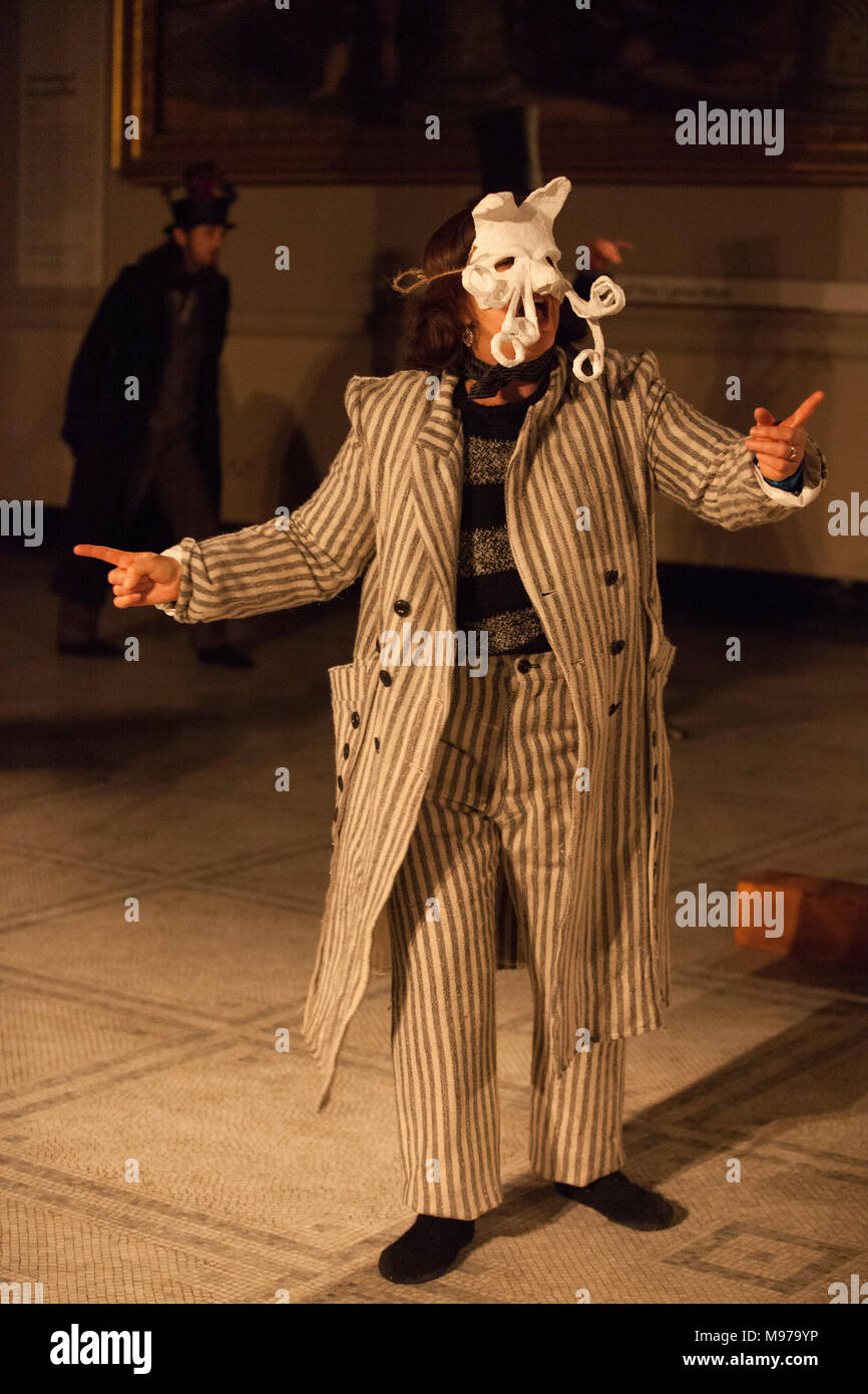 London, UK. 23rd Mar, 2018. Menswear designer John Alexander Skelton presented a collection at the V&A for their 'Fashion in Motion' series, using natural and craft techniques, based on ideas of the Green Man and spring rebirth, and set to singing by Vivien Ellis, shown here. Credit: Anna Watson/Alamy Live News Stock Photo