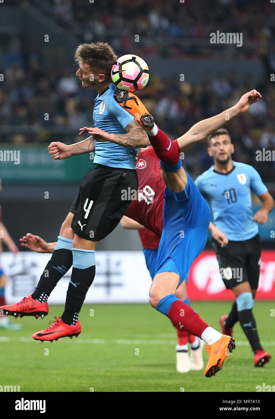 Nanning, China's Guangxi Zhuang Autonomous Region. 23rd Mar, 2018. Patrik Schick (R) of the Czech Republic vies with Guillermo Varela of Uruguay during the match between Uruguay and the Czech Republic at the 2018 China Cup International Football Championship in Nanning, capital of south China's Guangxi Zhuang Autonomous Region, March 23, 2018. Credit: Cao Can/Xinhua/Alamy Live News Stock Photo